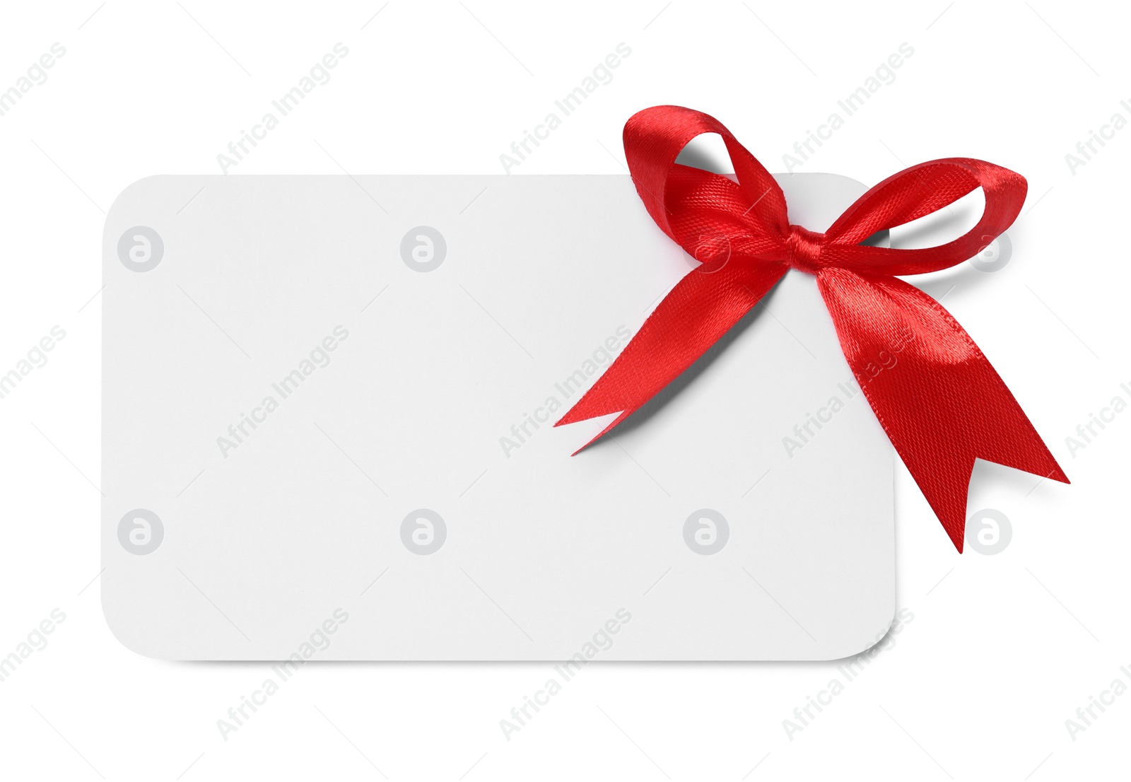 Photo of Blank gift card with red bow isolated on white, top view