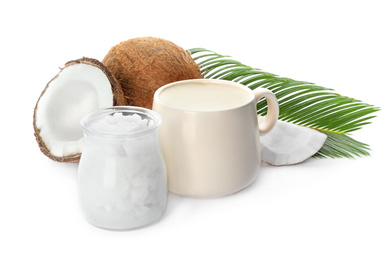 Photo of Delicious coffee with organic coconut oil and palm leaf isolated on white