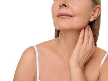 Photo of Mature woman touching her neck on white background, closeup