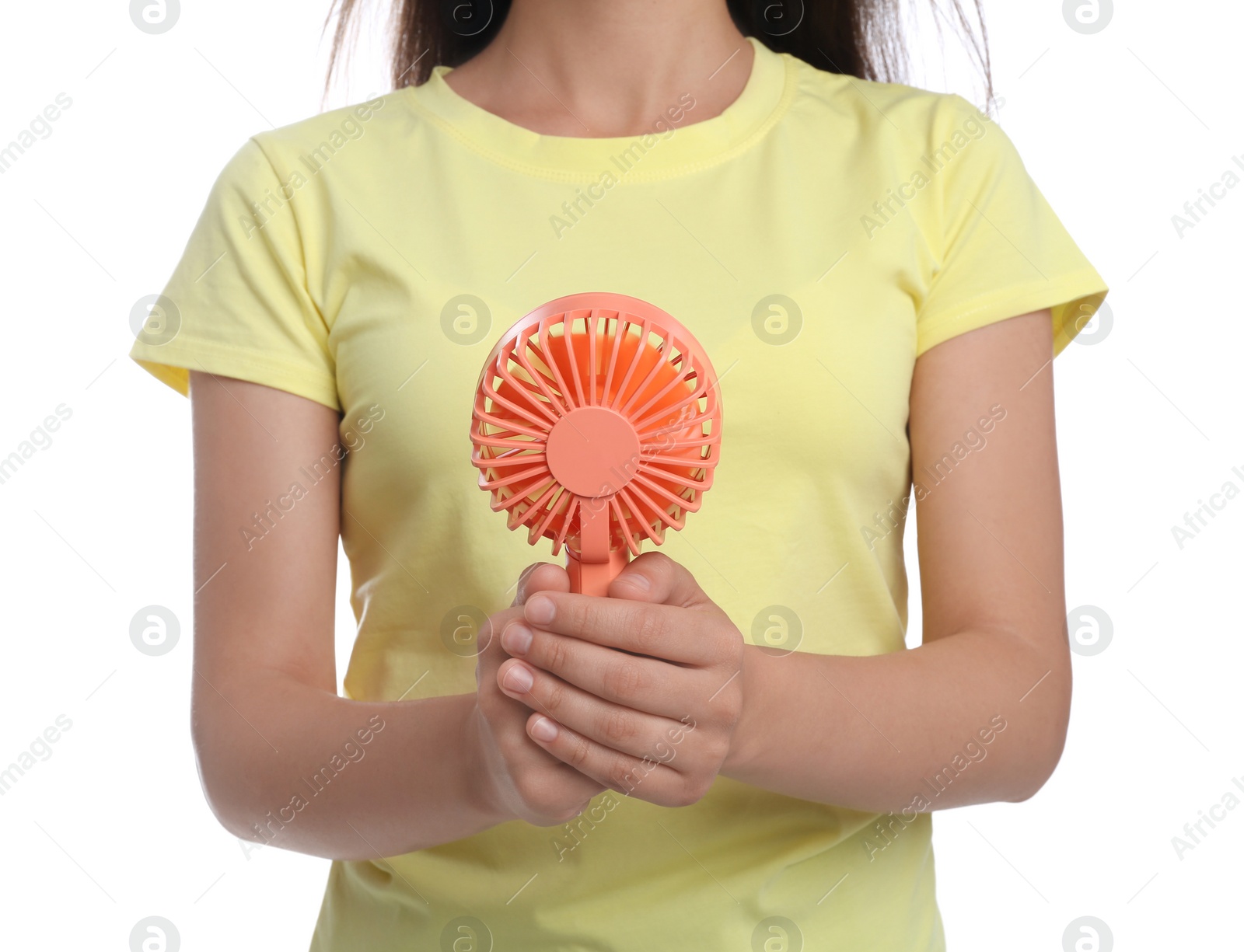 Photo of Woman with portable fan on white background, closeup. Summer heat