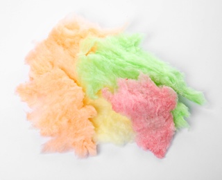 Photo of Pile of colorful cotton candy on white background