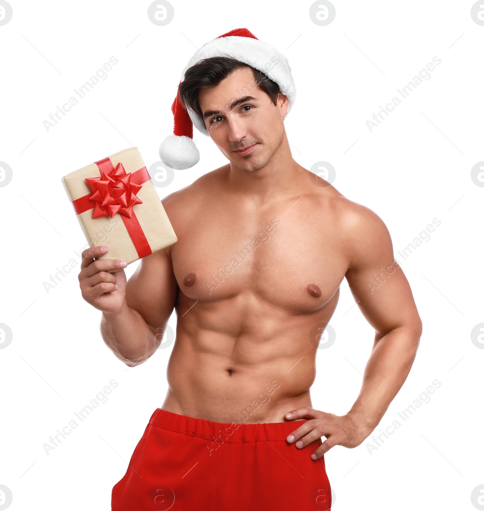 Photo of Sexy shirtless Santa Claus with gift on white background