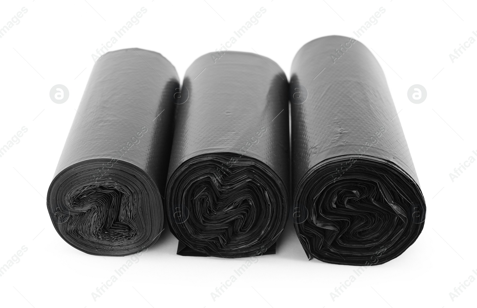 Photo of Rolls of black garbage bags isolated on white