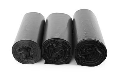 Photo of Rolls of black garbage bags isolated on white