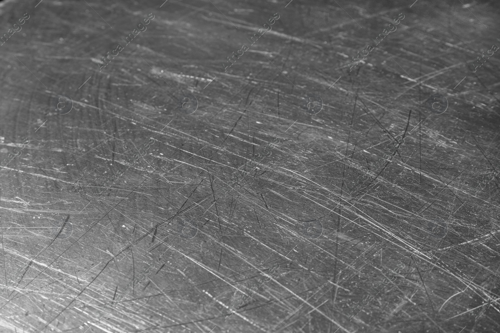 Photo of Texture of scratched metallic surface as background, closeup