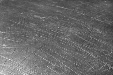 Photo of Texture of scratched metallic surface as background, closeup