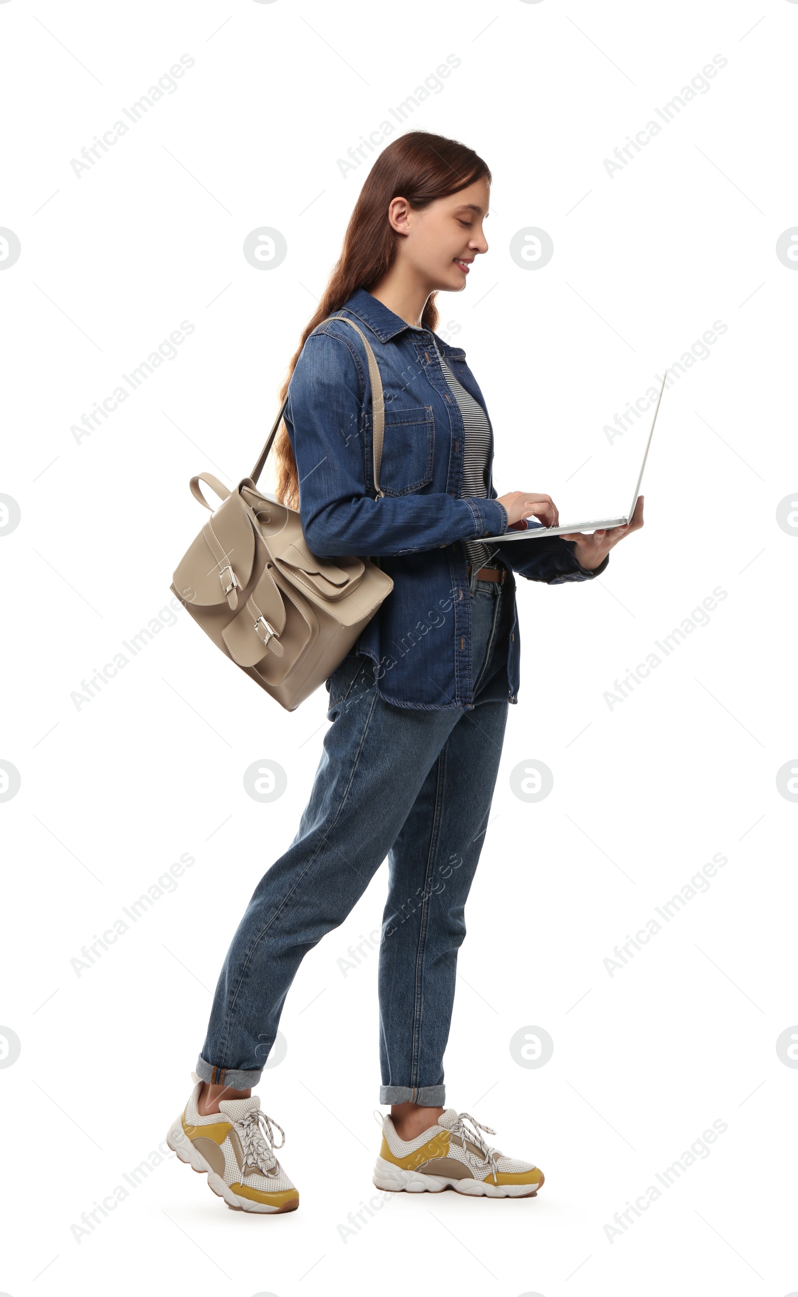 Photo of Teenage student with laptop and backpack on white background