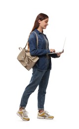 Teenage student with laptop and backpack on white background