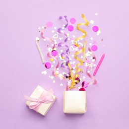Photo of Beautiful flat lay composition with gift box and festive items on violet background. Surprise party concept