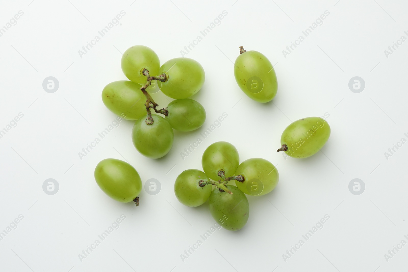 Photo of Fresh grapes on white background, top view