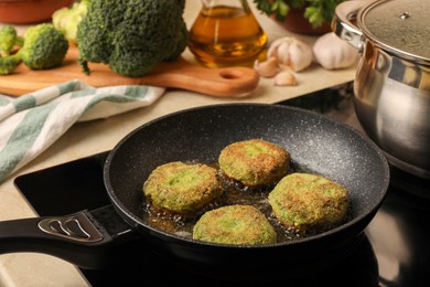 Photo of Cooking vegan cutlets in frying pan on stove