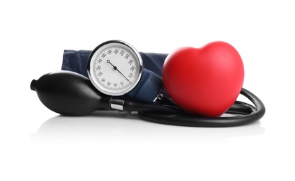 Photo of Blood pressure meter and toy heart on white background