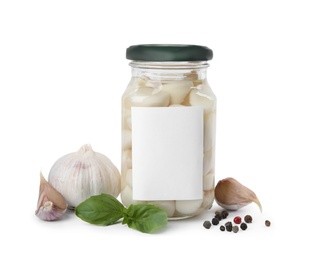 Photo of Composition with jar of pickled garlic on white background