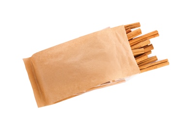 Aromatic dry cinnamon sticks on white background, top view