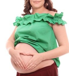 Photo of Young pregnant woman in casual clothes on white background