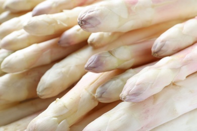 Photo of Fresh ripe white asparagus as background, closeup