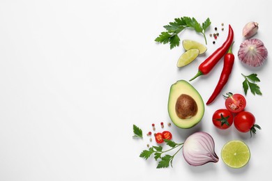 Fresh guacamole ingredients on white background, flat lay. Space for text