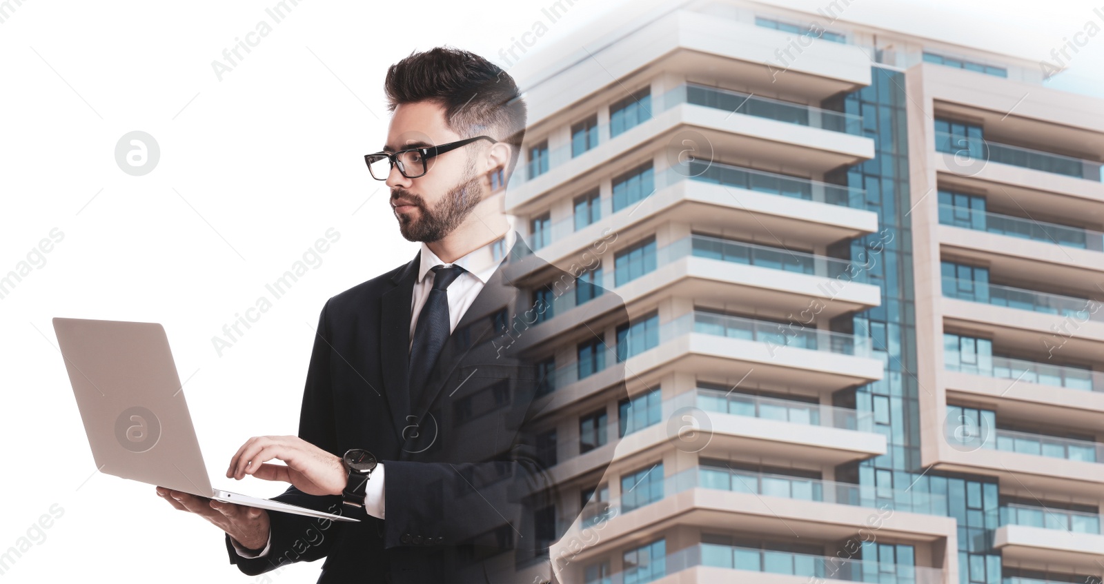 Image of Double exposure of architect working with laptop and building