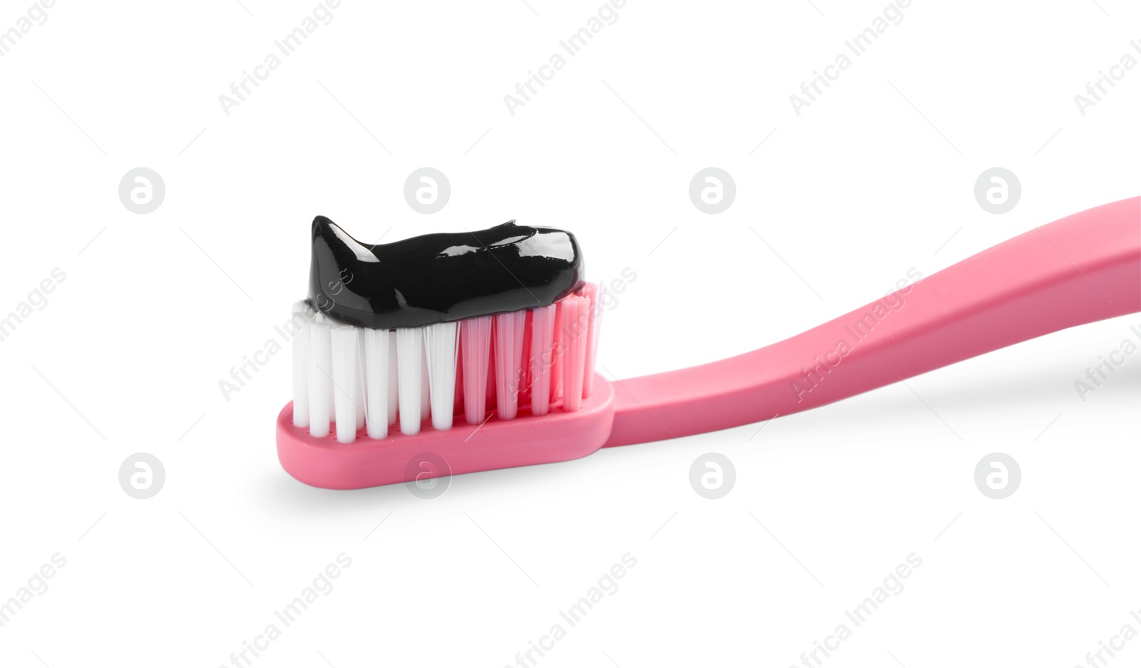 Photo of Brush with charcoal toothpaste isolated on white