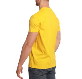 Man wearing yellow t-shirt on white background, closeup. Mockup for design