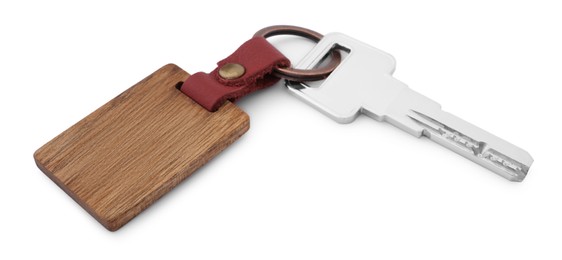 Photo of Key and wooden keychain with Ukrainian coat of arms isolated on white