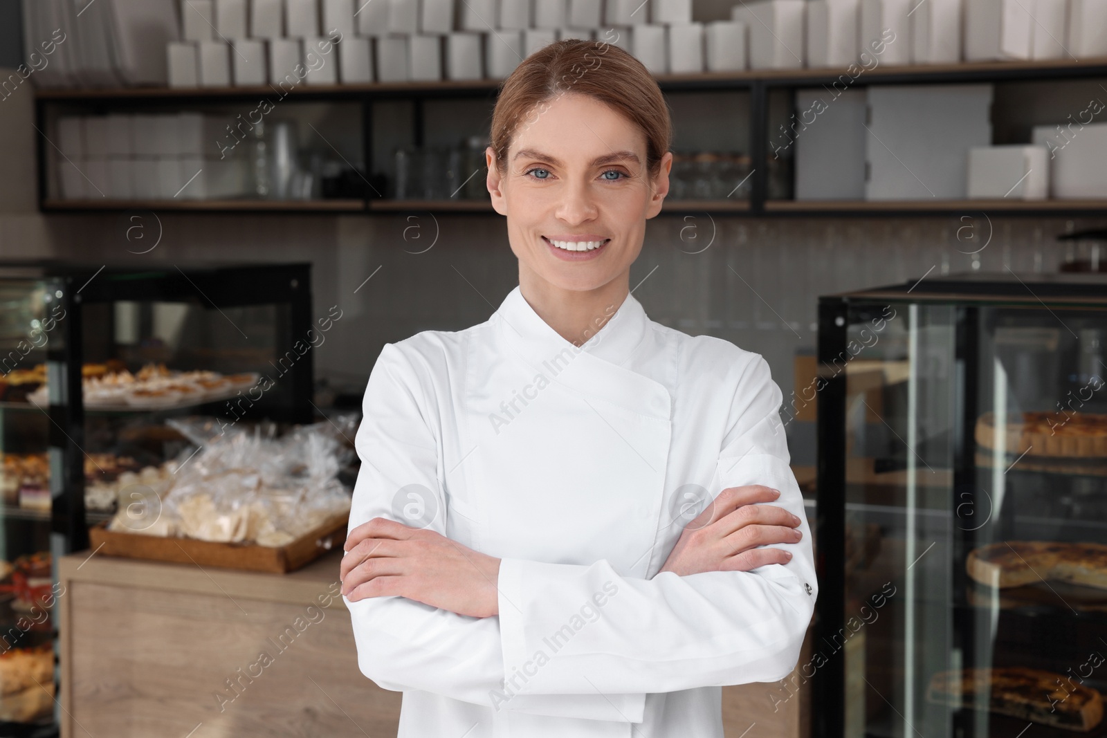 Photo of Portrait of professional baker in bakery shop