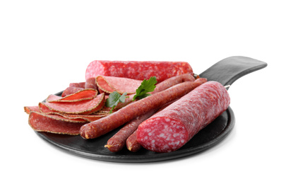 Photo of Slate plate with different tasty sausages isolated on white