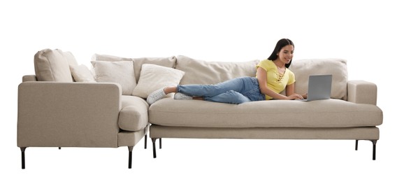 Photo of Young woman with laptop on comfortable sofa against white background