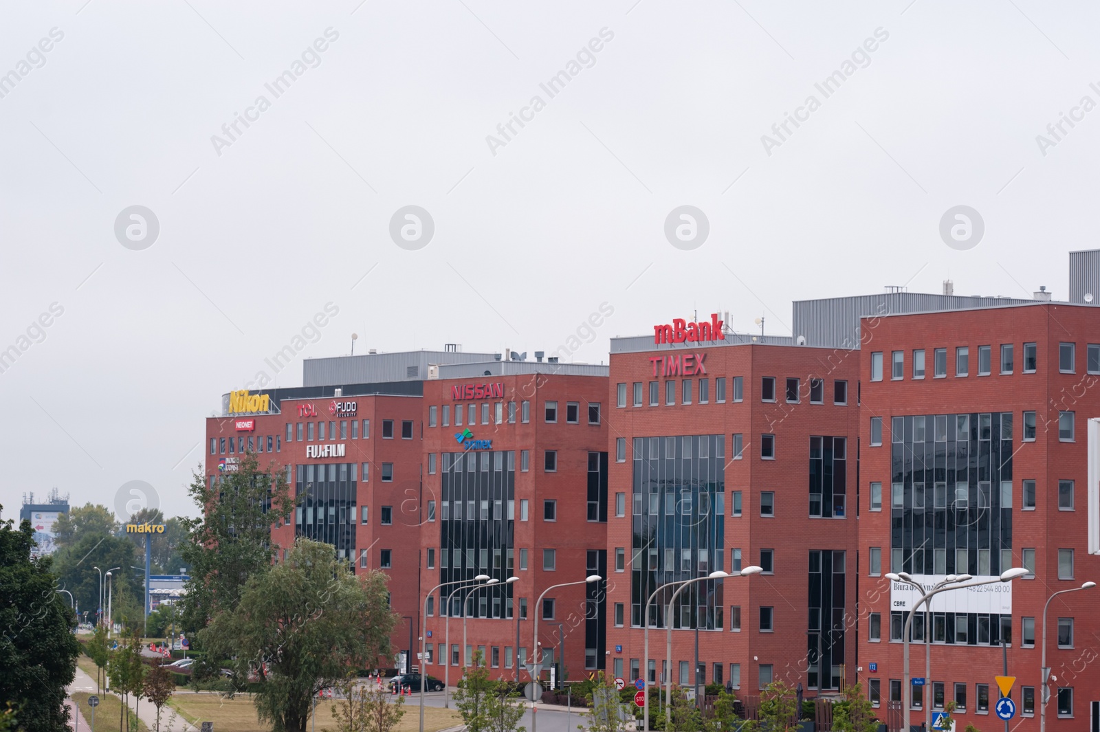 Photo of Warsaw, Poland - September 10, 2022: Buildings with many modern logos outdoors