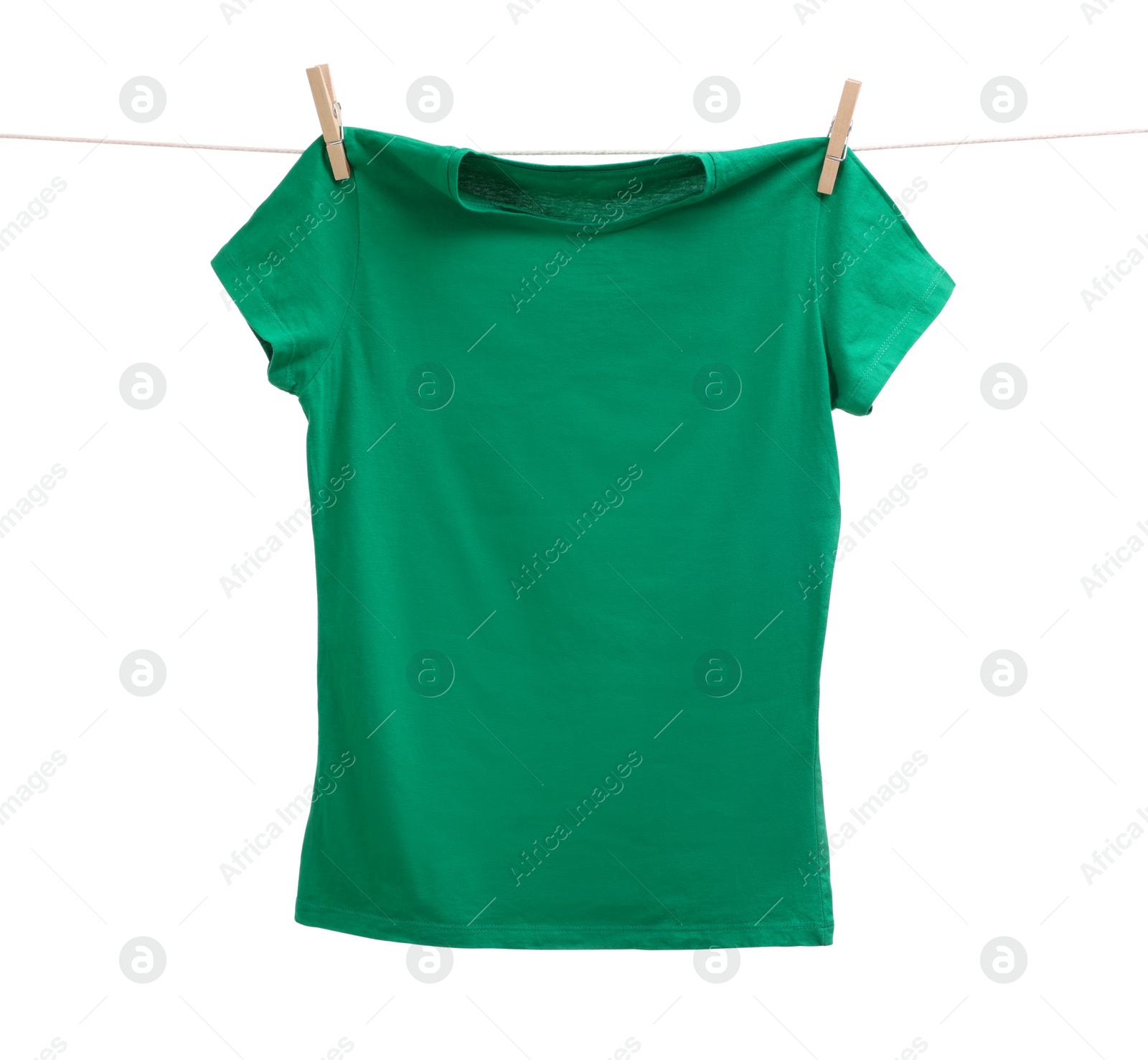 Photo of One green t-shirt drying on washing line isolated on white