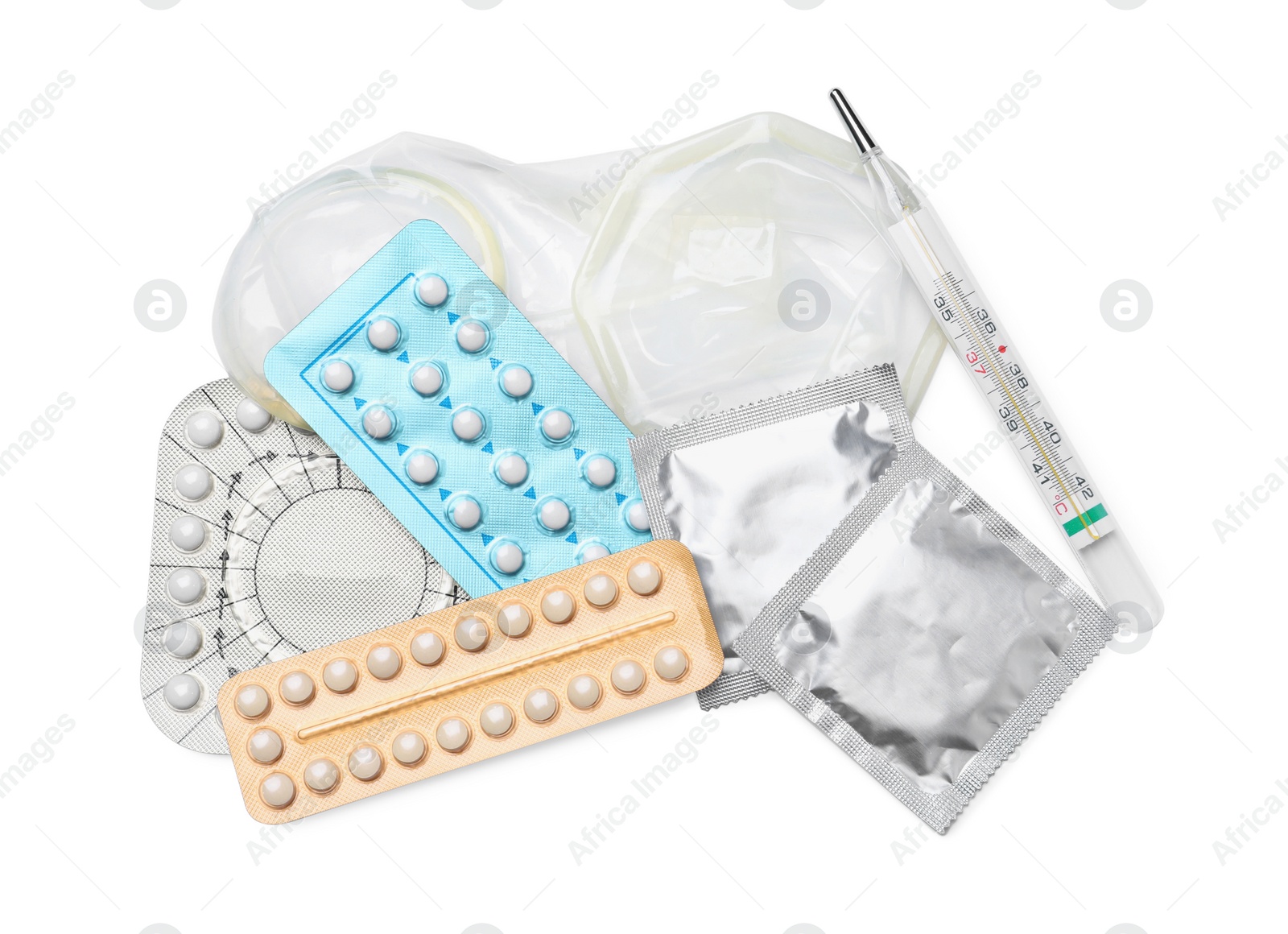 Photo of Contraceptive pills, condoms and thermometer isolated on white, top view. Different birth control methods