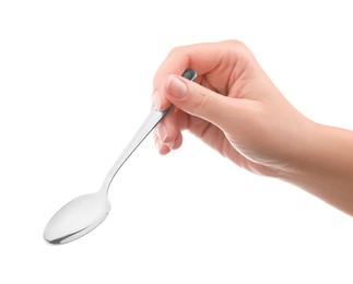 Woman holding new shiny spoon on white background, closeup