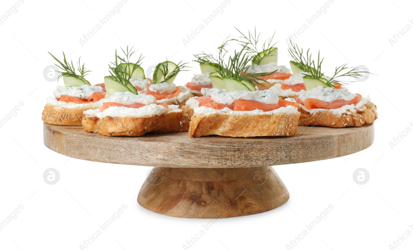 Photo of Tasty canapes with salmon, cucumber, cream cheese and dill isolated on white