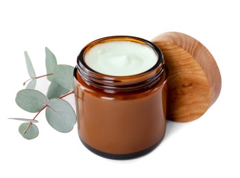 Photo of Jar of hand cream and eucalyptus on white background