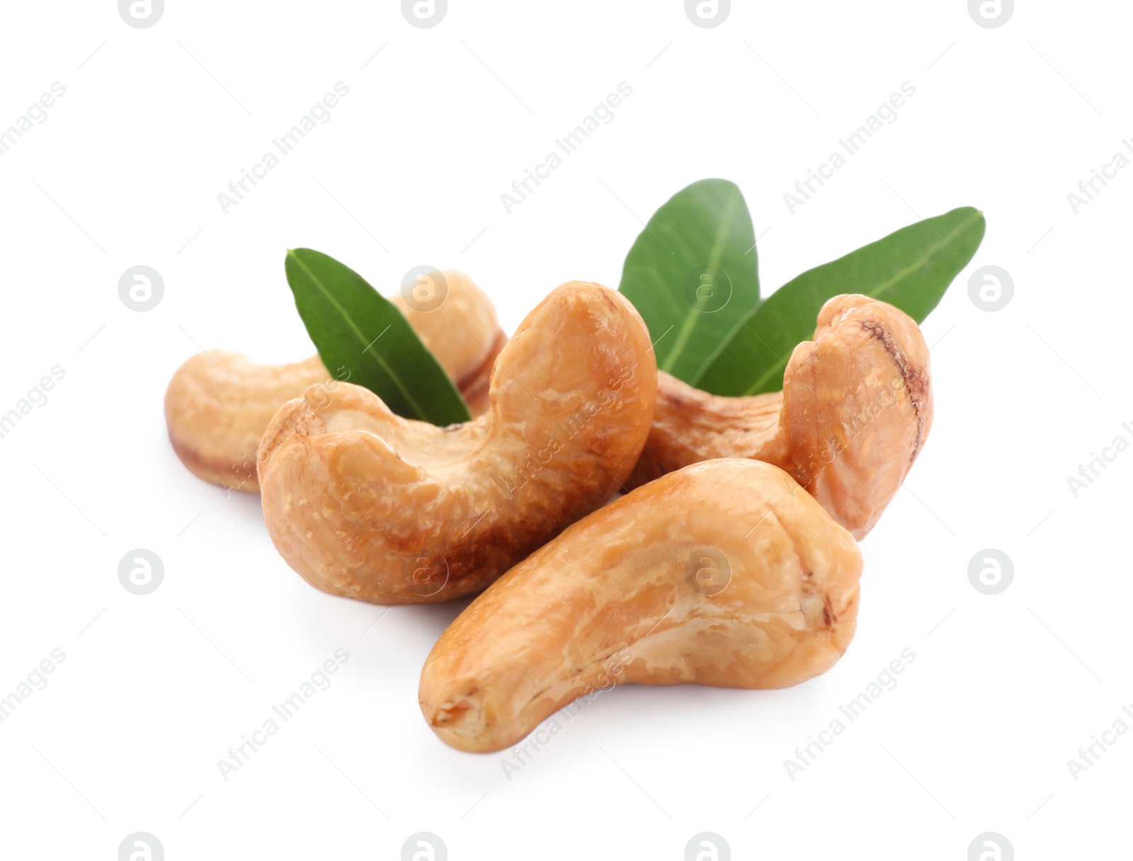 Photo of Tasty organic cashew nuts and green leaves isolated on white