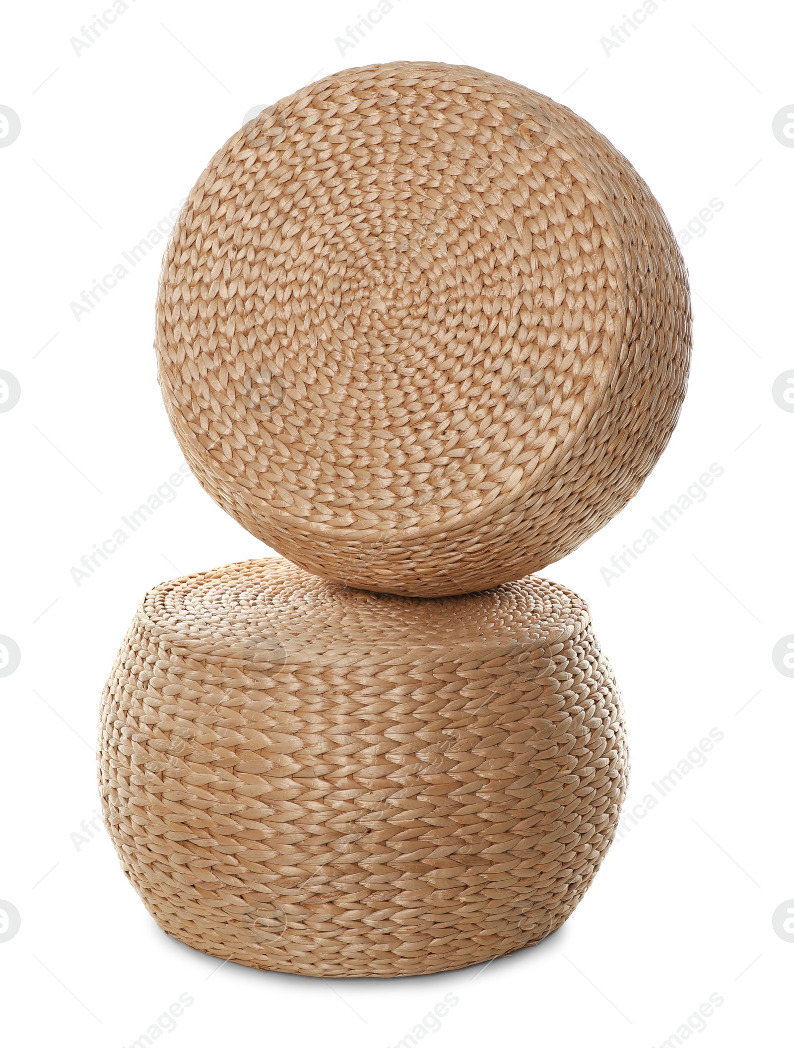 Photo of Two stylish wicker poufs on white background