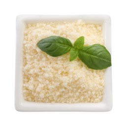 Photo of Square bowl with grated parmesan cheese and basil isolated on white, top view