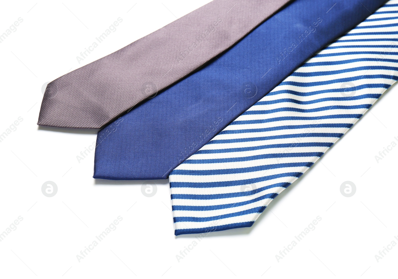 Photo of Color male ties isolated on white, closeup