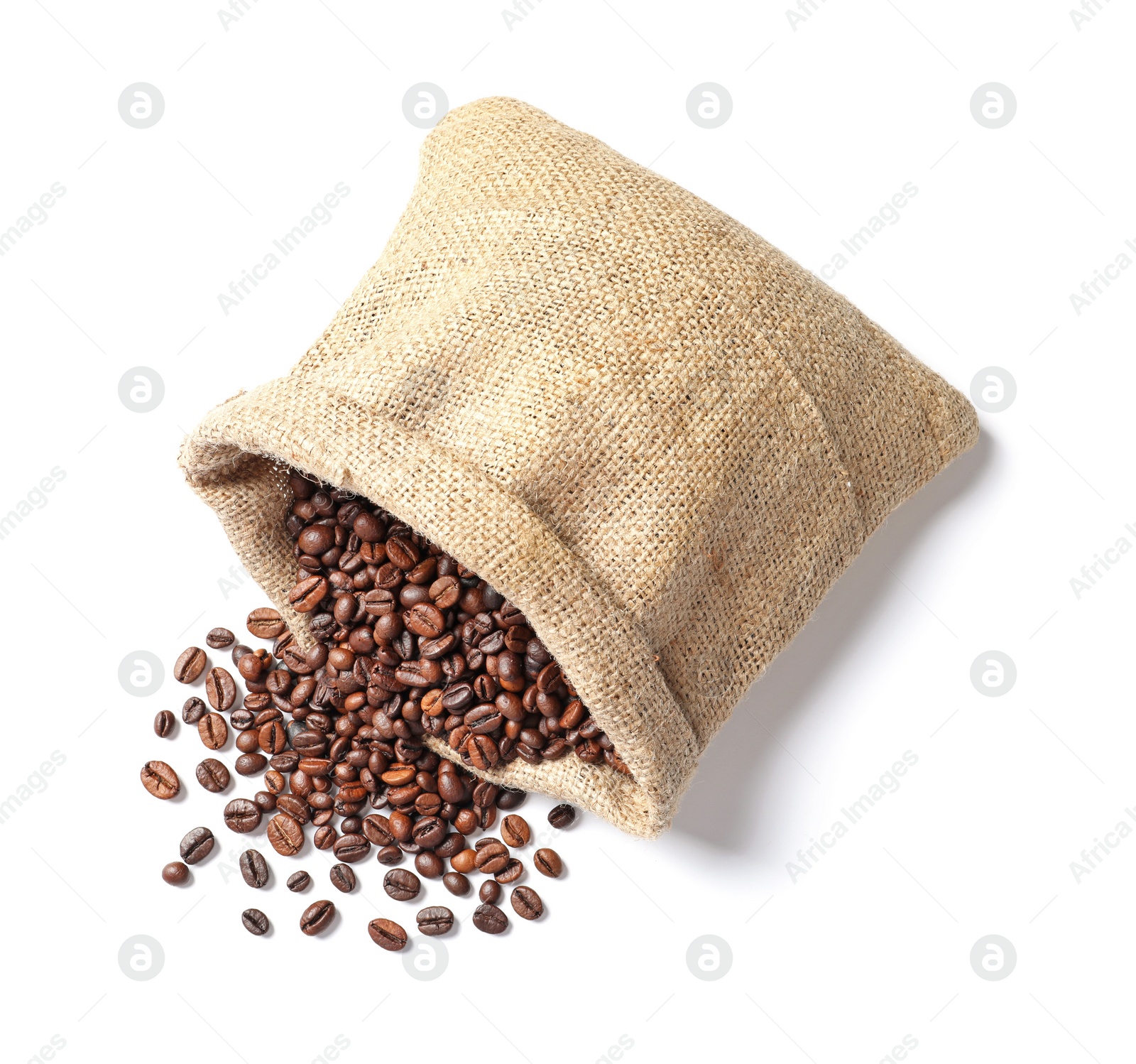 Photo of Overturned bag with roasted coffee beans on white background, top view