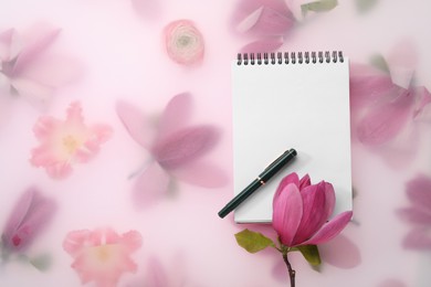Photo of Guest list. Notebook, pen and magnolia on spring floral background, flat lay. Space for text