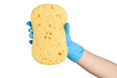 Photo of Cleaner in rubber glove holding new yellow sponge on white background, closeup