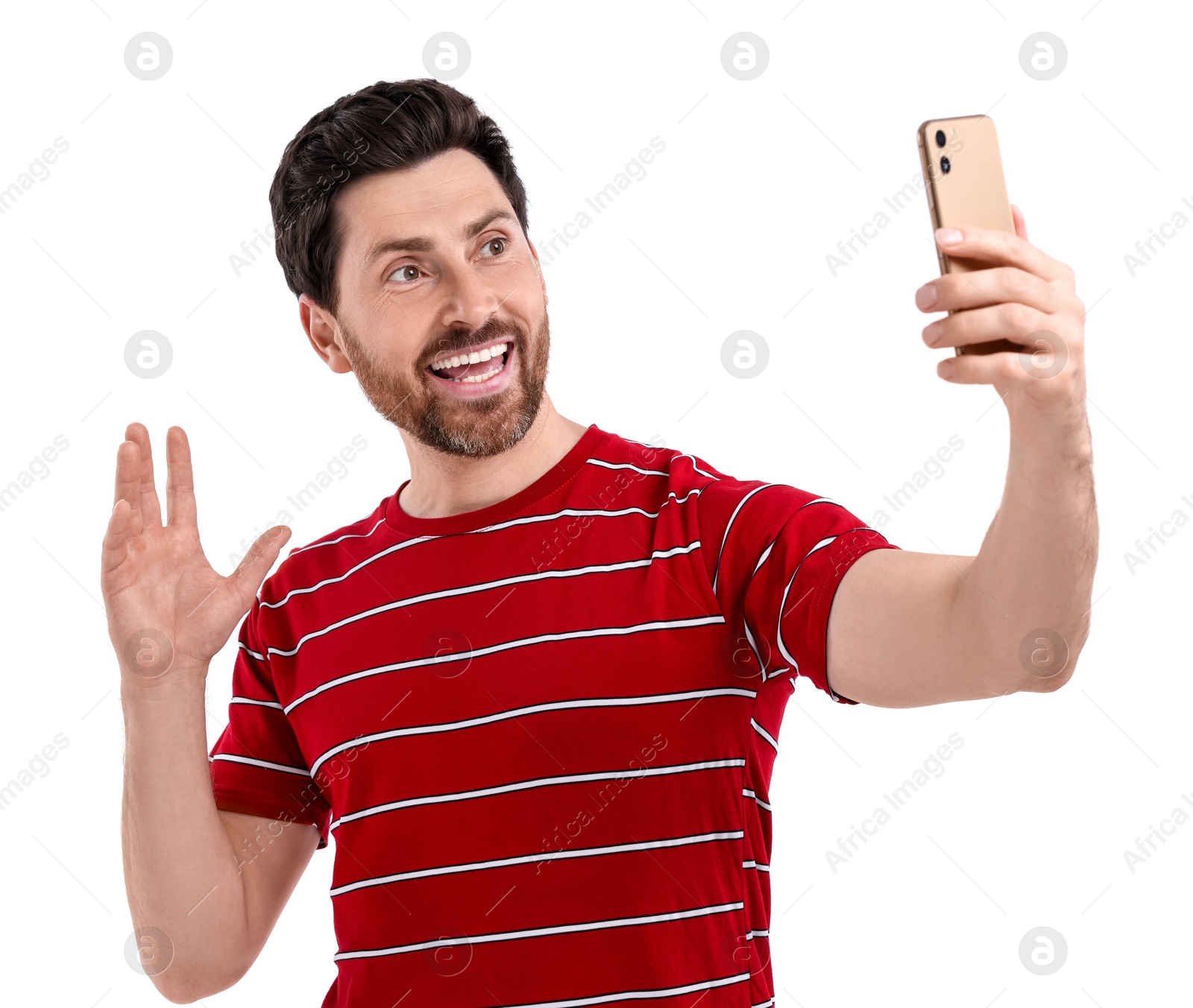 Photo of Smiling man taking selfie with smartphone on white background