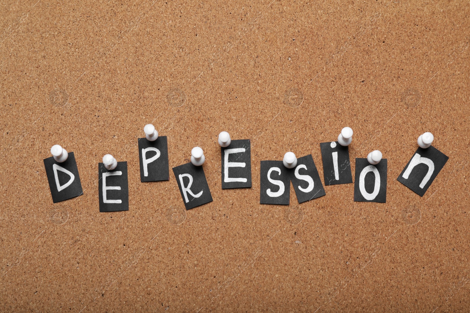 Photo of Word Depression made of letters pinned to corkboard