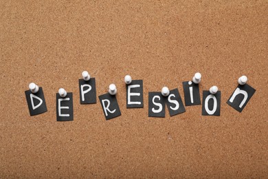 Photo of Word Depression made of letters pinned to corkboard