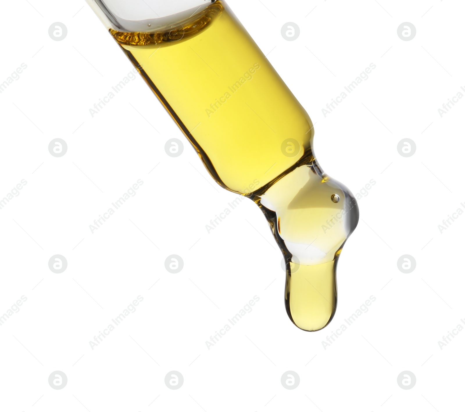 Photo of Dripping tincture from pipette isolated on white