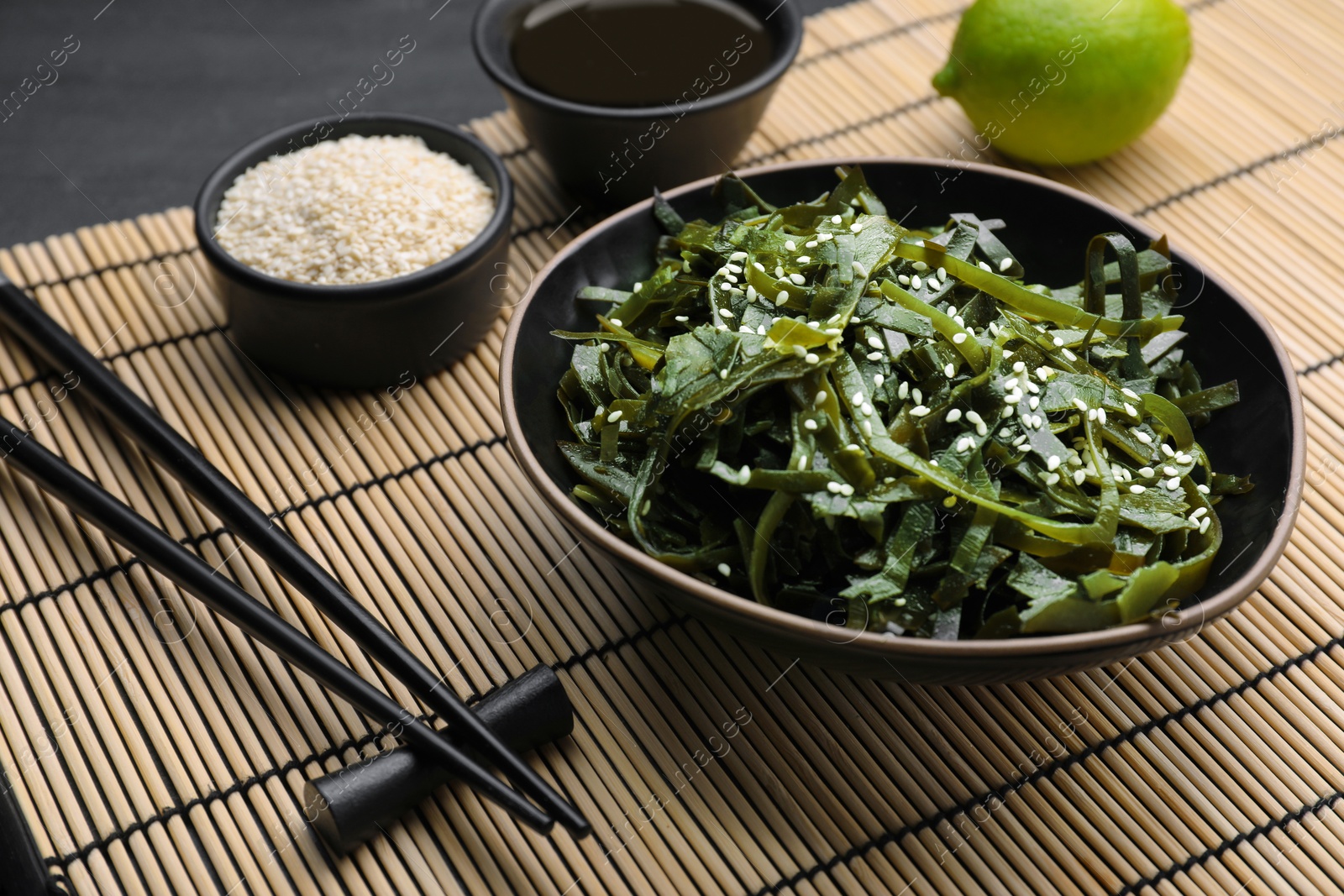 Photo of Fresh laminaria (kelp) seaweed served on table