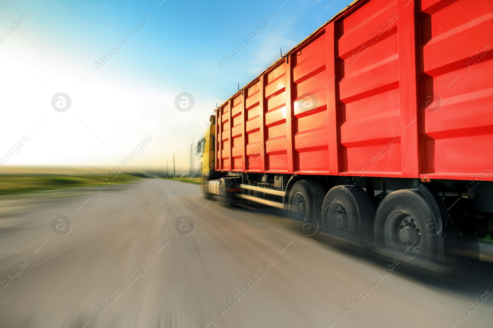 Image of Logistics concept. Truck on country road, motion blur effect 