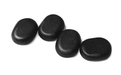 Photo of Group of black stones on white background