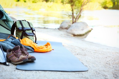 Photo of Sleeping bag and other camping gear outdoors