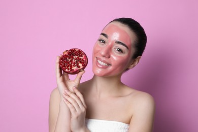 Photo of Woman with pomegranate face mask and fresh fruit on pink background